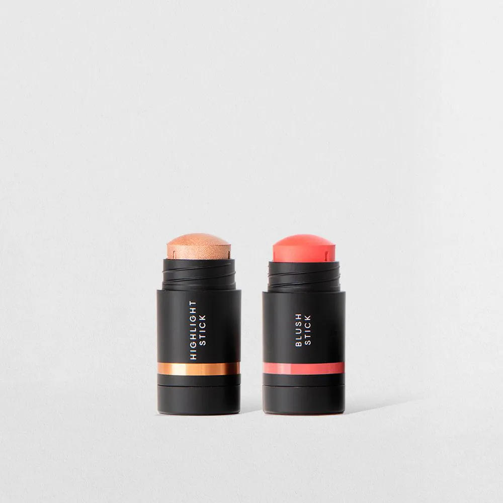 KIT MINI ILUMINADOR EM BASTãO + MINI BLUSH EM BASTãO CORAL (2 PRODUTOS)